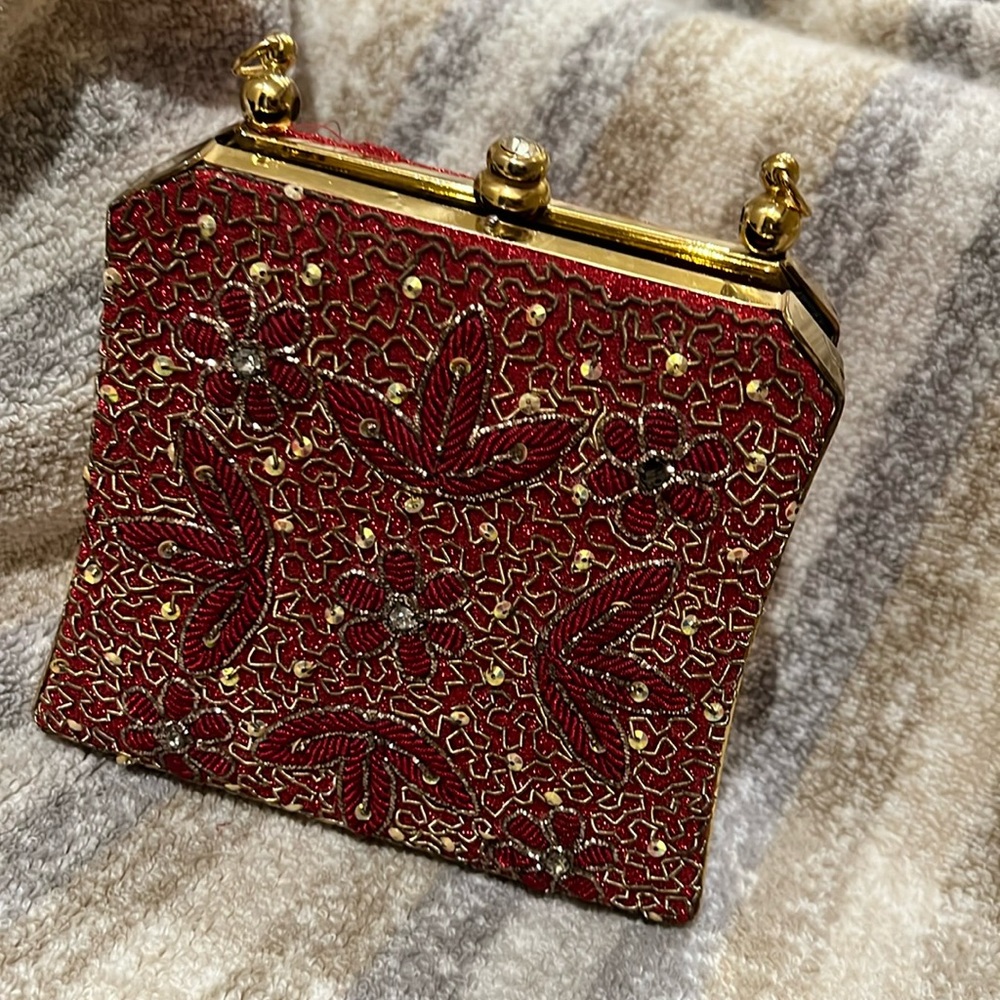Antique gold and red clutch with bead and sequin detail.